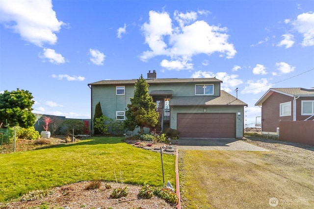 view of front of home with driveway, an attached garage, and a front lawn