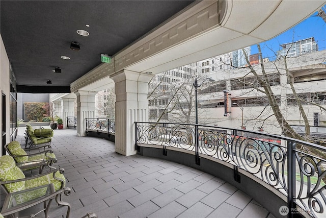 view of patio featuring a balcony