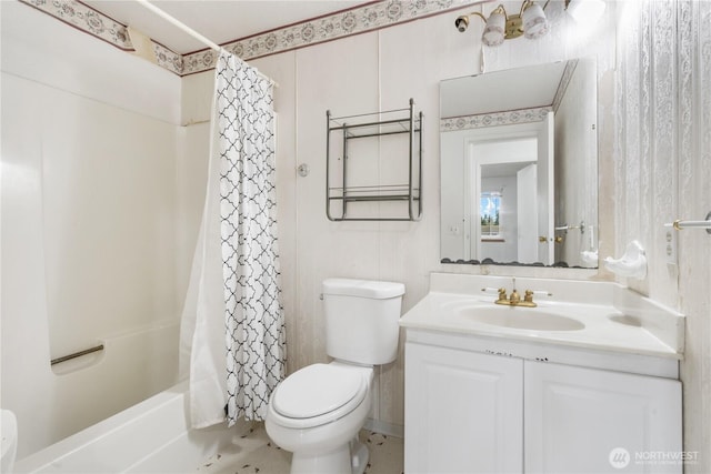 bathroom featuring shower / bath combo with shower curtain, toilet, and vanity