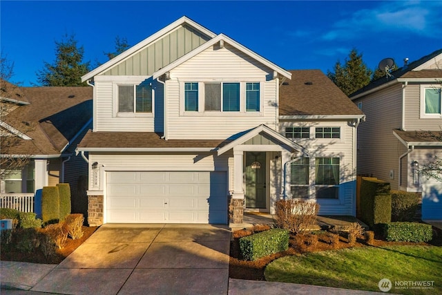 craftsman inspired home featuring concrete driveway, stone siding, roof with shingles, an attached garage, and board and batten siding