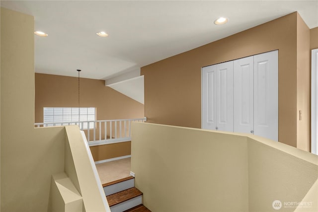 stairs featuring recessed lighting