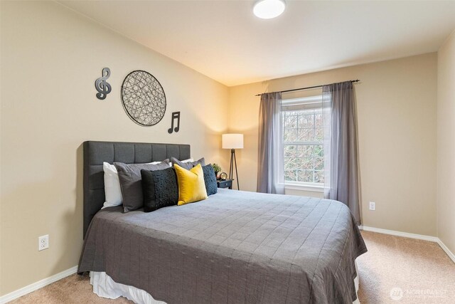 bedroom with carpet flooring and baseboards