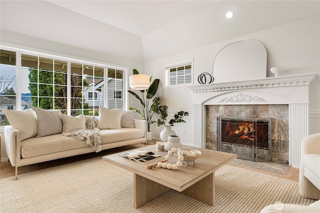 living area with recessed lighting and a premium fireplace