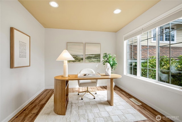 office space with recessed lighting, visible vents, baseboards, and wood finished floors