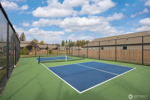 view of sport court featuring community basketball court and fence