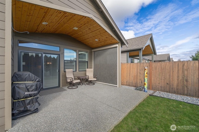 view of patio featuring fence