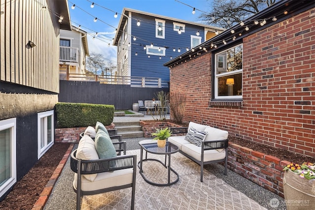 view of patio with outdoor lounge area and fence