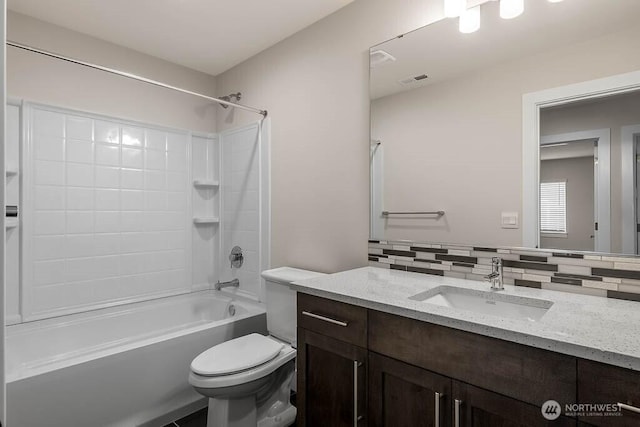 full bath with visible vents, backsplash, toilet, vanity, and  shower combination