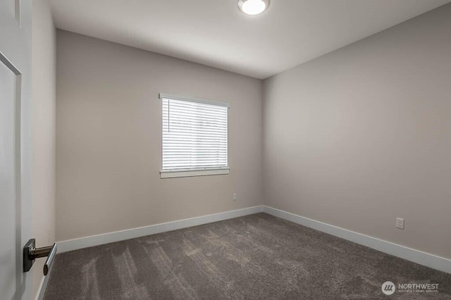 empty room with carpet flooring and baseboards