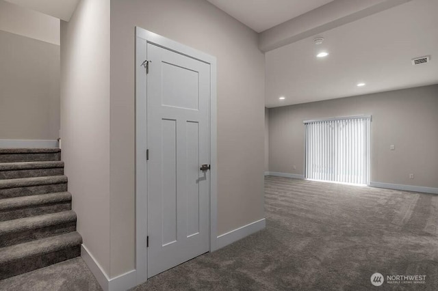 interior space featuring stairway, carpet, visible vents, and baseboards