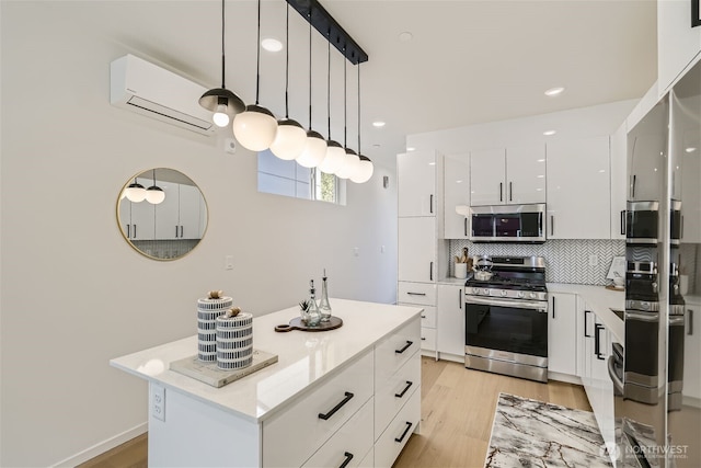 kitchen featuring stainless steel appliances, backsplash, white cabinetry, modern cabinets, and a wall mounted air conditioner