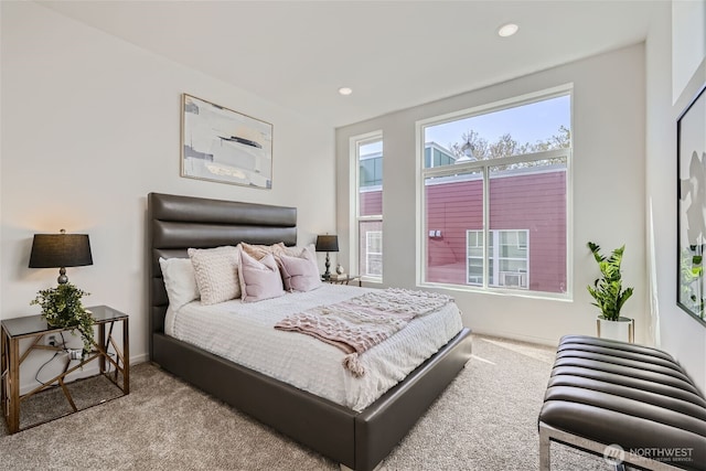 bedroom with carpet floors and recessed lighting