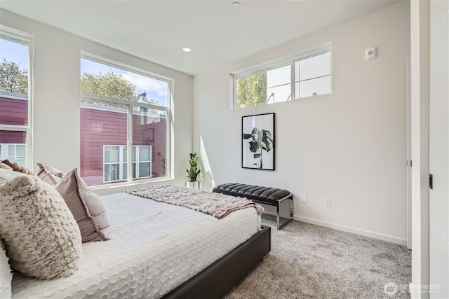 carpeted bedroom with baseboards and recessed lighting