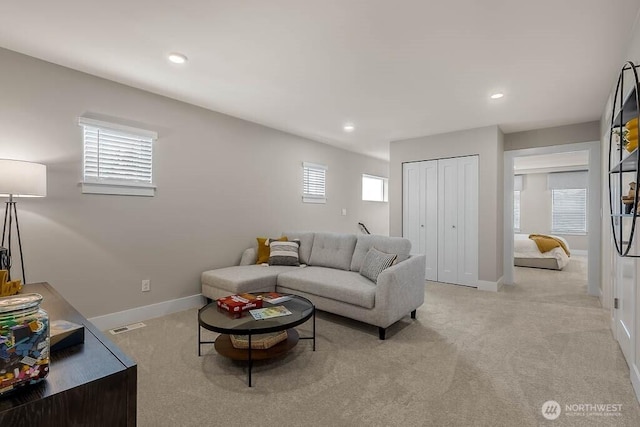 living room with recessed lighting, carpet, visible vents, and baseboards