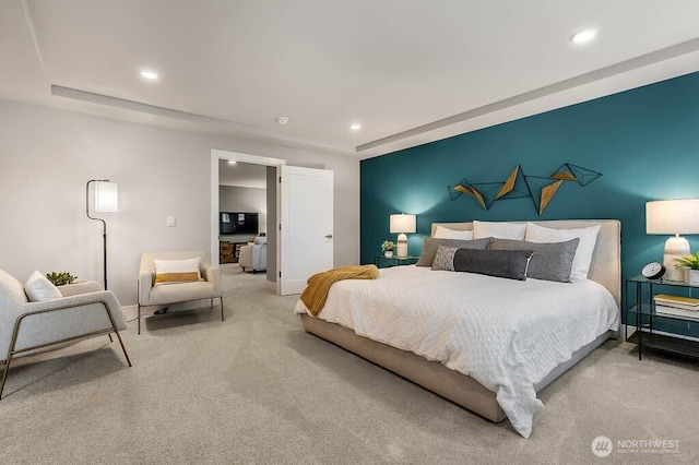 carpeted bedroom featuring an accent wall, baseboards, and recessed lighting