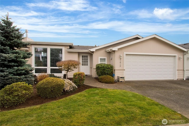 ranch-style house featuring a garage, driveway, a front lawn, and stucco siding