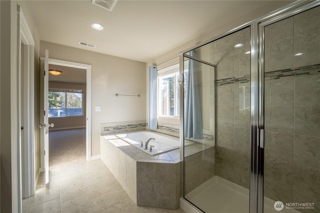 bathroom featuring a shower stall, a bath, visible vents, and tile patterned floors