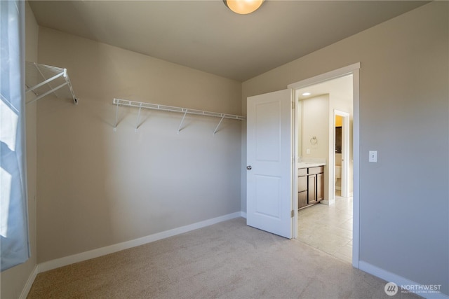 spacious closet with light colored carpet