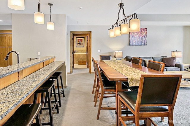 dining room featuring light colored carpet