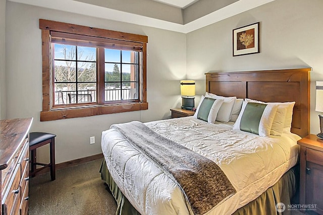 bedroom with carpet flooring and baseboards