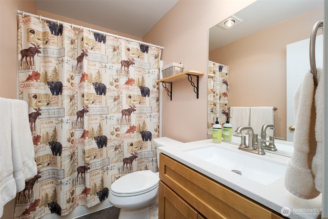 full bath featuring toilet and vanity