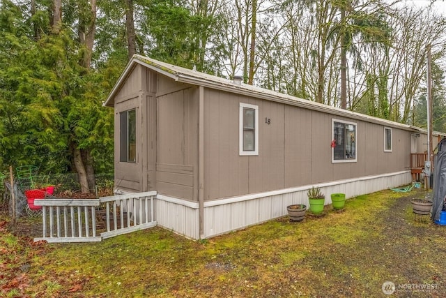 view of property exterior featuring a yard