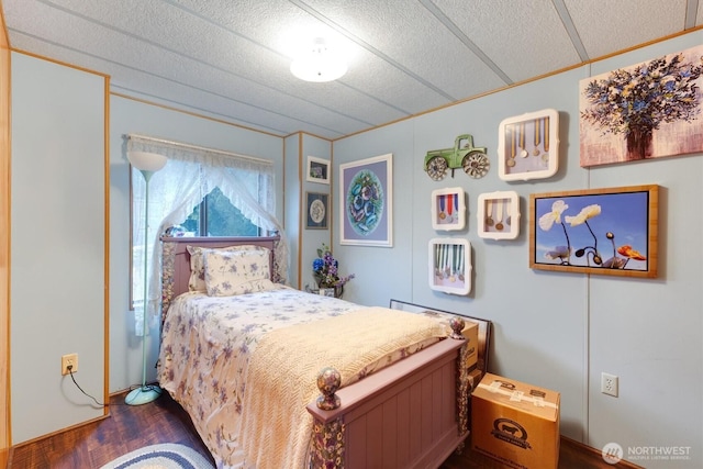 bedroom featuring dark wood-type flooring