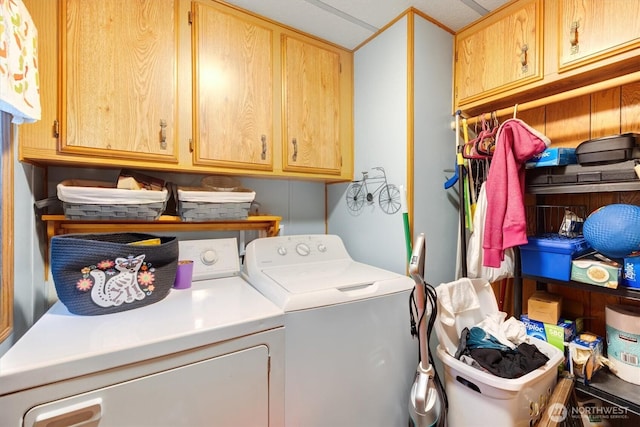 laundry room featuring cabinet space and independent washer and dryer