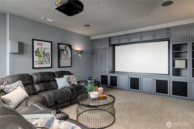 carpeted home theater with visible vents