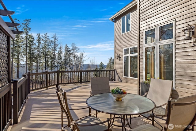 deck with outdoor dining area