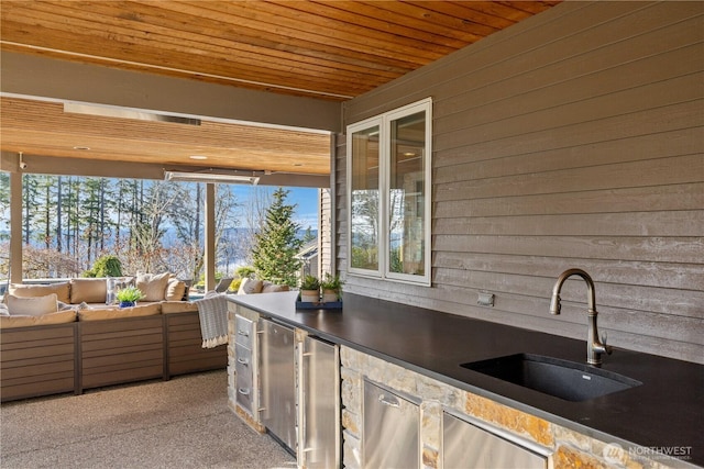 view of patio / terrace featuring an outdoor hangout area, area for grilling, and a sink