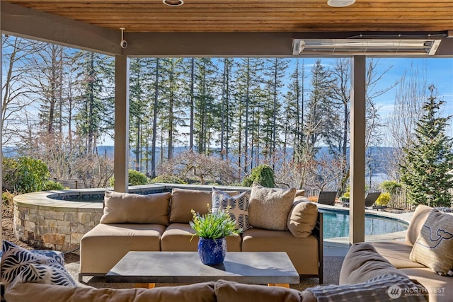 sunroom / solarium featuring wood ceiling and plenty of natural light