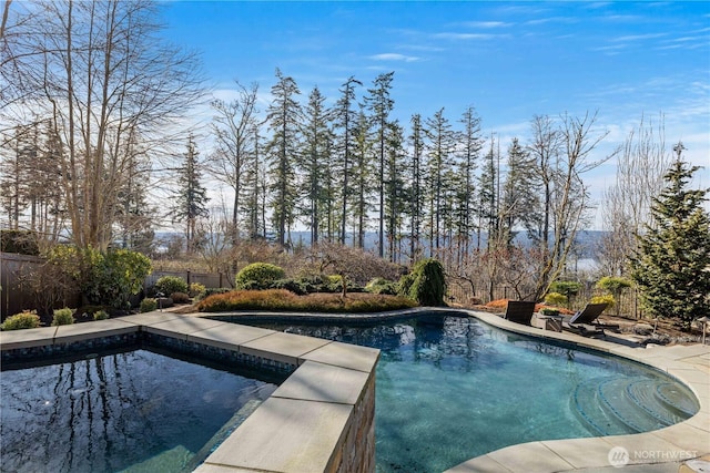 view of swimming pool with fence and a fenced in pool