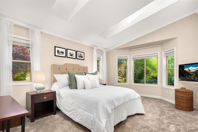 bedroom with carpet floors, baseboards, and vaulted ceiling