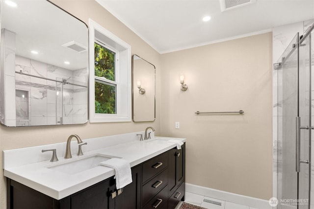 full bath with visible vents, a sink, and a shower stall