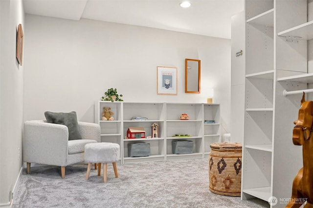 living area featuring carpet floors and recessed lighting