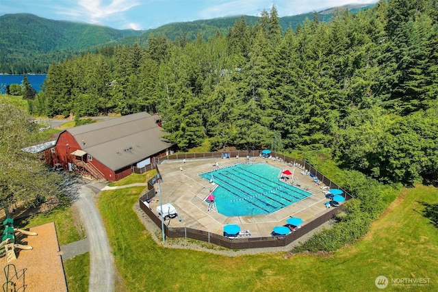 birds eye view of property with a view of trees