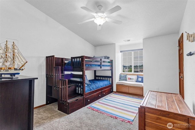 carpeted bedroom featuring ceiling fan, visible vents, and baseboards