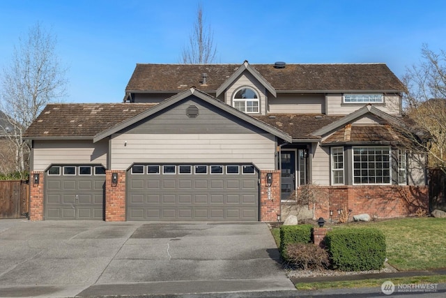 view of front of property with a garage, concrete driveway, and brick siding