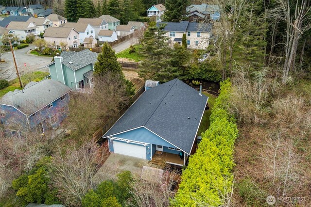 birds eye view of property with a residential view