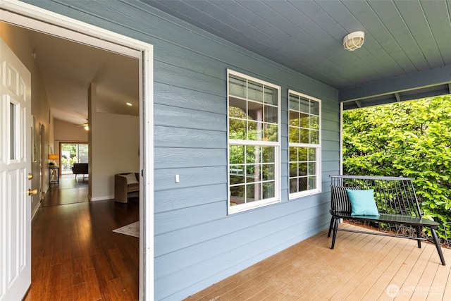 wooden terrace with a porch