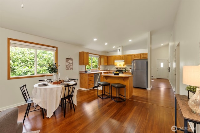 dining space with recessed lighting, baseboards, dark wood-type flooring, and vaulted ceiling