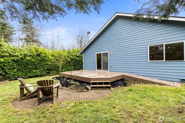 back of house with a yard, a patio area, and a deck