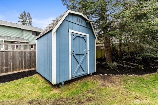 view of shed featuring a fenced backyard