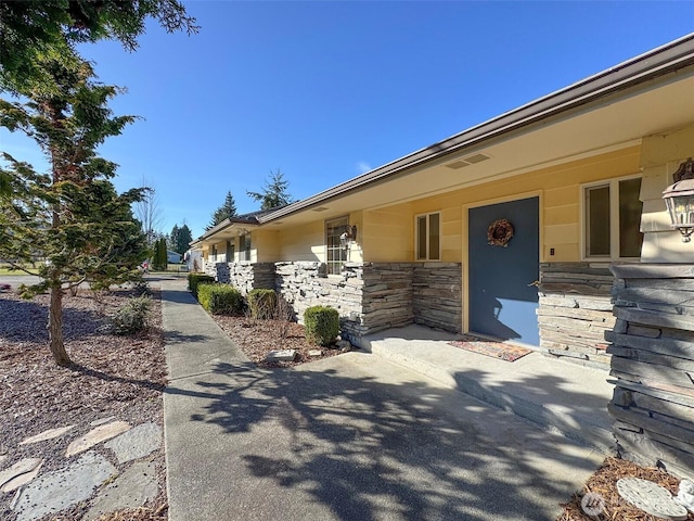 view of property exterior featuring stone siding