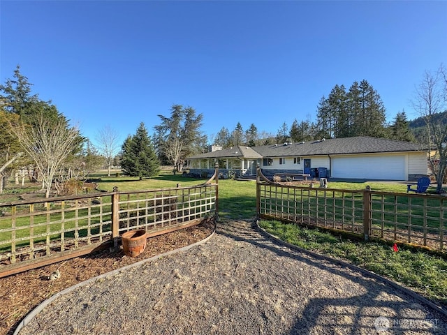 exterior space with a yard and fence private yard