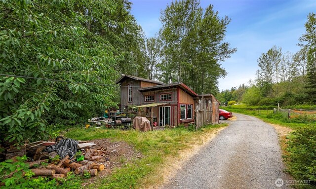 view of property exterior with driveway