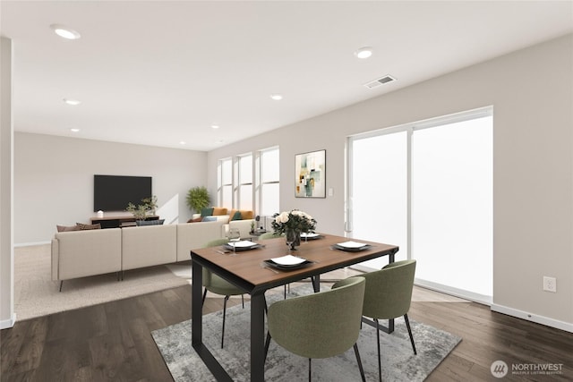 dining room featuring dark wood-style floors, baseboards, visible vents, and recessed lighting