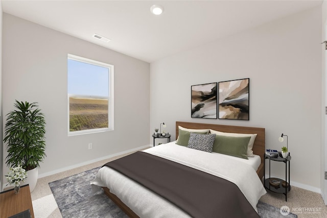 carpeted bedroom featuring visible vents and baseboards