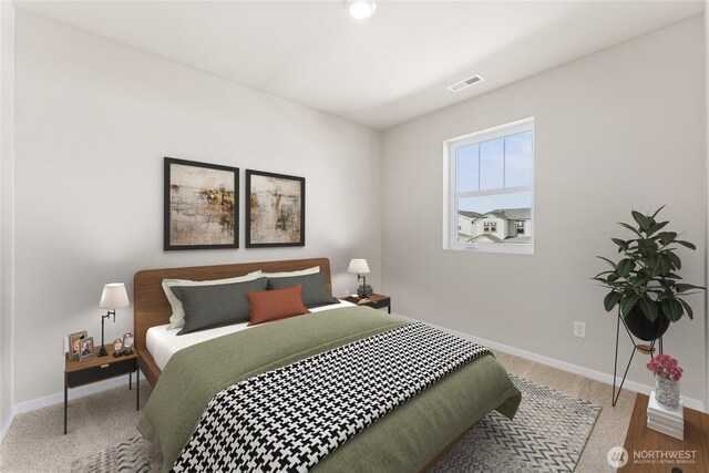 bedroom featuring visible vents and baseboards